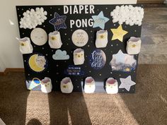 a sign that says diaper pong with lots of stars and moon decorations on it