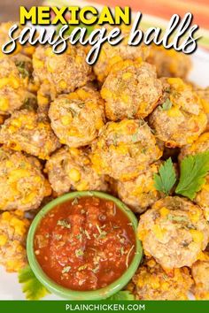 mexican sausage balls on a white plate with salsa in the middle and green garnish