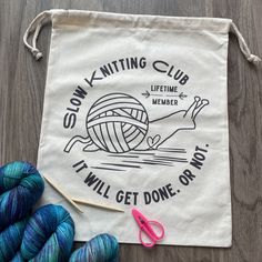 a bag with some knitting supplies on it