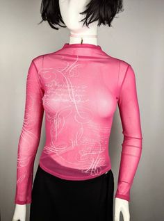 "Very nice vintage 90s turtleneck mesh top long sleeve tattoo abstract pattern from KENZO Junior. Cool for rave and everyday look. Size 16 tag, fits XS-S best (see measurements ) Condition 10/10 Underarm to underarm - 39.5 cm/15.5\" (the mesh stretches) Length from the back - 50 cm/19.7\" (the mesh stretches) Sleeve length - 68 cm/26.7\" (the mesh stretches) All measurements taken with garment lying flat. Vintage sizes vary greatly! We recommend comparing measurements with a similar style garmen Trendy Sheer Mesh Top For Winter, Y2k Style Crew Neck Mesh Top For Spring, Long Sleeve Mesh Top With Graphic Print For Party, Y2k Mesh Crew Neck Top For Spring, Y2k Crew Neck Mesh Top For Spring, Sheer Mesh Top Y2k Style For Spring, Y2k Style Stretch Mesh Top With Long Sleeves, Long Sleeve Graphic Print Mesh Top For Party, Y2k Long Sleeve Mesh Top For Spring