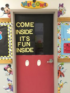 the door to mickey mouse's classroom is decorated with magnets