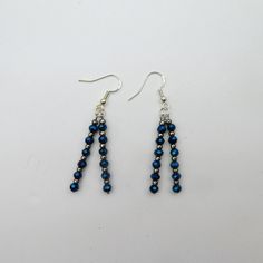 Set of handmade beaded earrings.  Made with blue sparkly beads.  The beads are upcycled, made with new sterling silver hooks. Recycled Beads, Handmade Earrings Beaded, Sparkly Earrings, Blue Beads, Sterling Silber, Earrings Handmade, Blue And Silver, Beaded Earrings, Favorite Jewelry