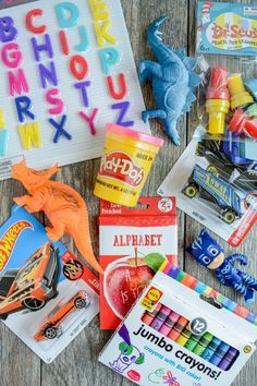 the contents of a children's craft kit laid out on top of a wooden table