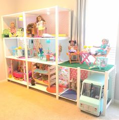 the doll house is filled with dolls and furniture