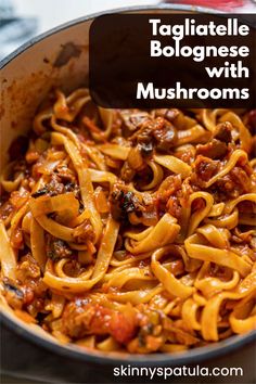 a pan filled with pasta and meat sauce