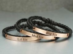 three personalized bracelets with names on them