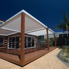 a wooden deck with an awning over it