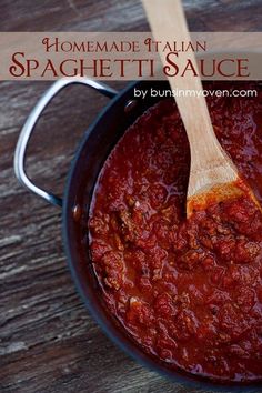 homemade italian spaghetti sauce in a black pot with a wooden spoon and title overlay reads homemade italian spaghetti sauce