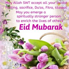 an eid mubarak greeting card with pink flowers and green leaves in a basket