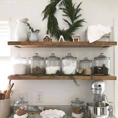 two shelves filled with kitchen items next to each other