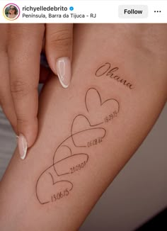 a woman's leg with three hearts and the names of her loved ones on it