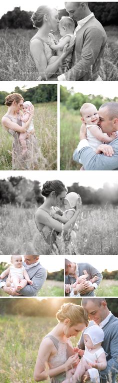 a man and woman holding a baby in a field