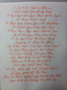 an orange and black handwriting on white paper