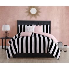 black and white striped bedding with pink accents