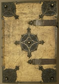 an old book with metal decorations on it