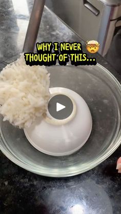 a bowl filled with white rice on top of a counter