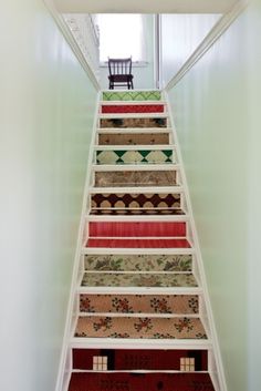 the stairs are painted with different colors and patterns