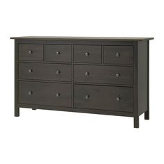 a dark colored dresser with six drawers