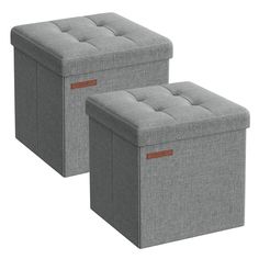 two grey storage boxes sitting next to each other