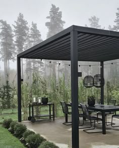 an outdoor dining area with table and chairs