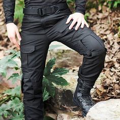 Black Utility Cargo Pants For Outdoor, Black Military Hiking Bottoms, Military Style Black Hiking Bottoms, Black Combat Bottoms For Outdoor, Black Cargo Style Hiking Pants, Black Cargo Pants For Hiking, Black Cargo Hiking Pants, Combat Style Cargo Pants For Outdoor, Combat Style Trousers For Outdoor Activities