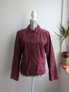 BUY 2 ITEMS GET 15% off at checkout   BUY 3 ITEMS GET 25% off at checkout  This is a vintage distressed suede leather trucker jacket for women with button up closure and pockets. This suede leather jacket is made of soft suede leather in mulberry purple pink color. The suede leather has an aged look due to the marks and scratches on the leather surface. This boho chic western leather jacket for women has two side pockets. It has polyester lining. This grunge jacket is by the brand Chico's. The s Purple Suede Jacket Outfit, Dark Pink Velvet Jacket, Purple Corduroy Jacket, Vintage Fitted Suede Leather Jacket, Dark Purple Leather Jacket, Pink Suede Jacket, Grunge Jacket, Purple Pink Color, Vintage Suede