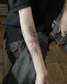 a person with a tattoo on their arm