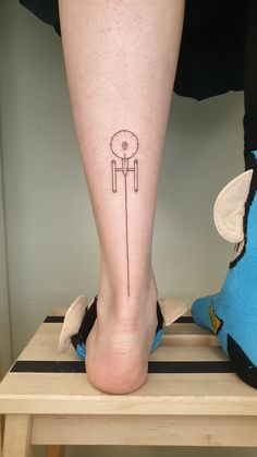 a person with a tattoo on their leg