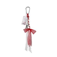 a red and white keychain with a tag attached to it's side