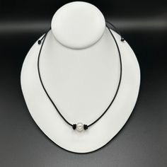 Adjustable Elegant natural freshwater pearl & leather necklace/choker  - high luster AA+ grade, natural, 9-10mm, near-round pearl - naturally dyed, premium, matte, round leather cord; conditioned with mink oil - stainless steel slide bead adjusts size for closure - fits up to 25" length - choose your leather color - arrives in an organza bag for easy gifting  100% natural freshwater pearl is used; therefore each one is unique & varies slightly in size, shape & character Pearl Leather Necklace, Boho Choker Necklace, Leather Pearl Necklace, Boho Choker, Pearl Leather, Round Leather, Necklace Choker, Naturally Dyed, Leather Necklace