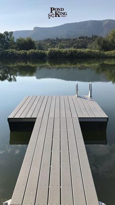 a wooden dock sitting on top of a lake