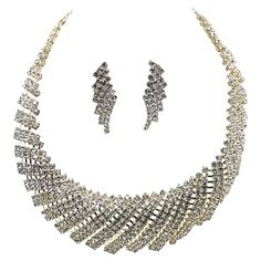 Rhinestone statement necklace with matching post-back earrings. Earrings: 2"L x 0.70"W. Necklace: 1.5"W x 0.20"D; adjusts from 16"L to 20"L. W Necklace, Rhinestone Statement Necklace, Necklace And Earrings, Metal Jewelry, Diamond Necklace, Statement Necklace, Jewelry Earrings, Drop Earrings, Collar