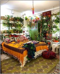 a bed room with a neatly made bed and lots of plants