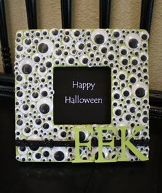 a black and white photo frame with the words happy halloween written in green on it