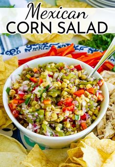 mexican corn salad in a bowl with tortilla chips