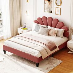 a bedroom with a bed, chair and pictures hanging on the wall above it's headboard