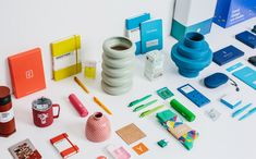 an assortment of office supplies are displayed on a white surface