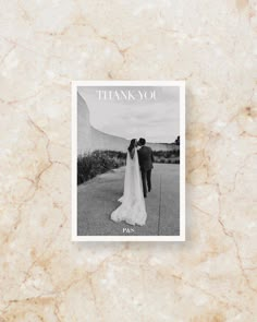 a wedding card with the words thank you on it and a photo of a bride and groom