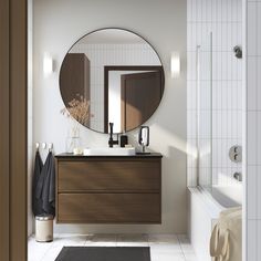 a bathroom with a sink, mirror and bathtub