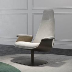 a modern chair sitting on top of a rug