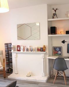 a living room filled with furniture and a flat screen tv sitting on top of a wooden floor