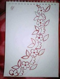 a drawing of flowers and leaves on a sheet of white paper with red marker markers