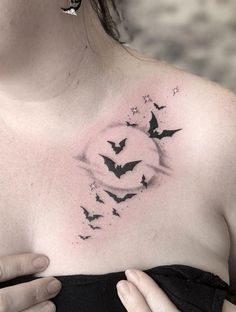 a woman's chest with bats on it