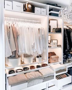 an organized closet with clothes and accessories