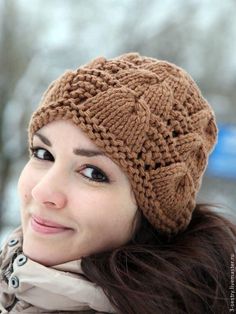 a woman wearing a brown knitted hat and scarf