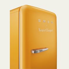 an orange refrigerator with the words smes on it's front and bottom door