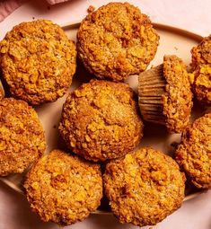 some muffins are on a plate with a brush