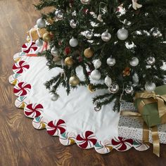 a christmas tree skirt with ornaments on it