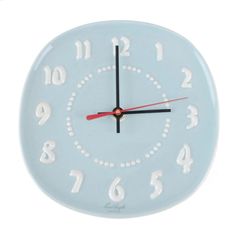 a blue clock with white numbers on the face and red hands is shown in front of a white background