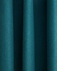 a close up view of a blue curtain